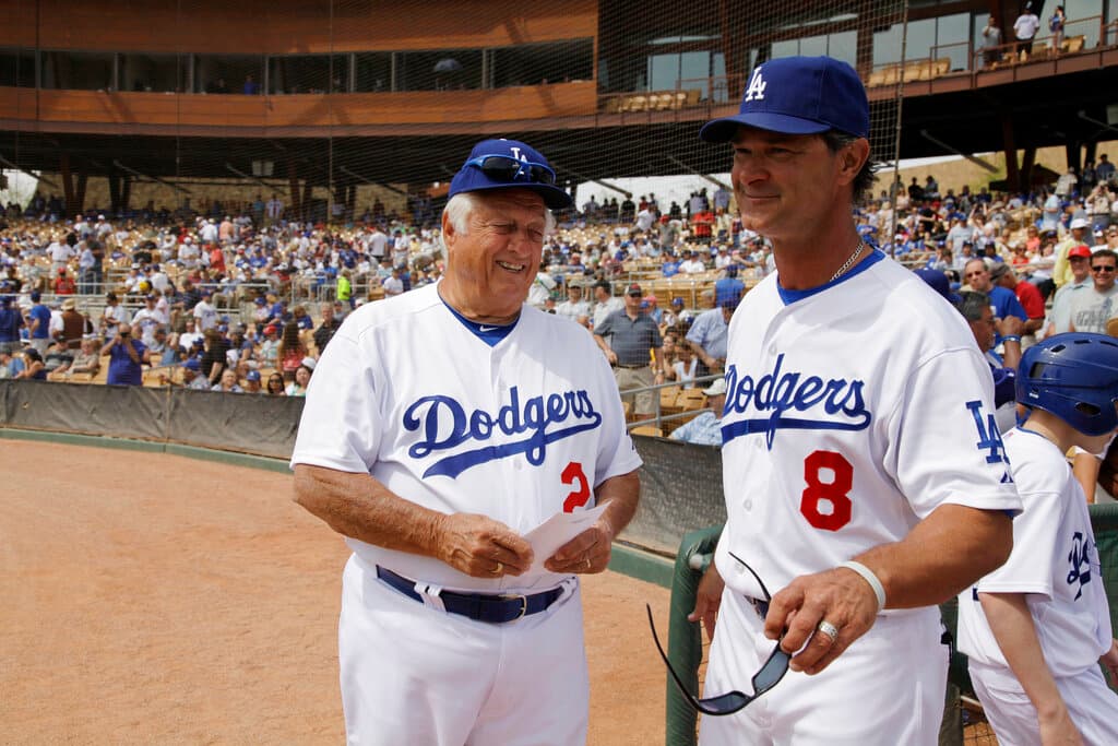 Title: Brewers Dodgers Spring Baseball Image ID: 11031909861 Article: Los Angeles Dodgers' Tommy Lasorda, left, and manager Don Mattingly smile as they talk to each others before the Dodgers' spring training baseball game against the Milwaukee Brewers on Saturday, March 19, 2011, in Glendale, Ariz. (AP Photo/Nam Y. Huh)