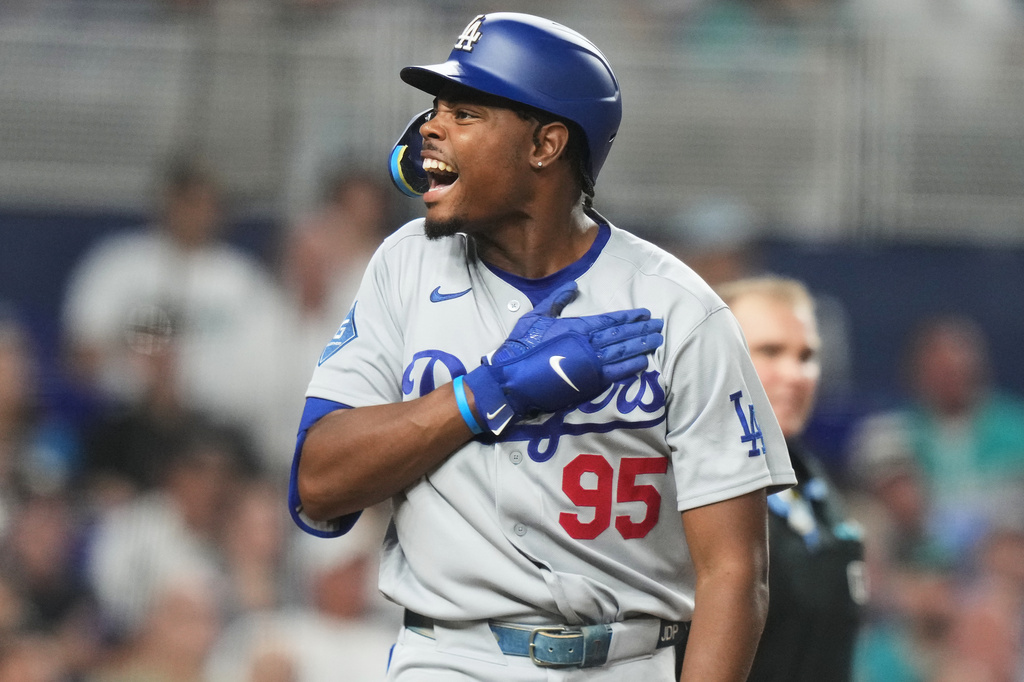 Dodgers outfielder Josue De Paula reacts after hitting a three-run home run against the Marlins.