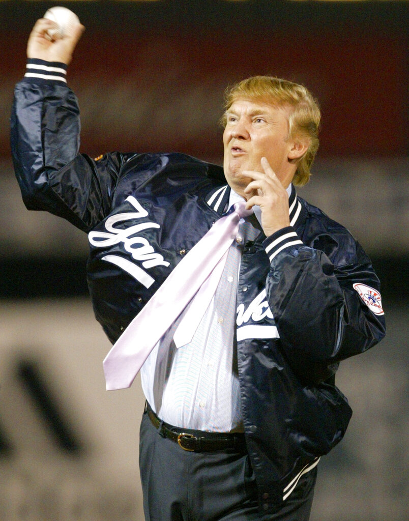 Title: ASTROS YANKEES SPRINGImage ID: 04031203881
Article:  Businessman Donald Trump throws out the first pitch before the New York Yankees faced the Houston Astros, Friday, March 12, 2004, at Legends Field in Tampa, Fla. (AP Photo/Kathy Willens)
