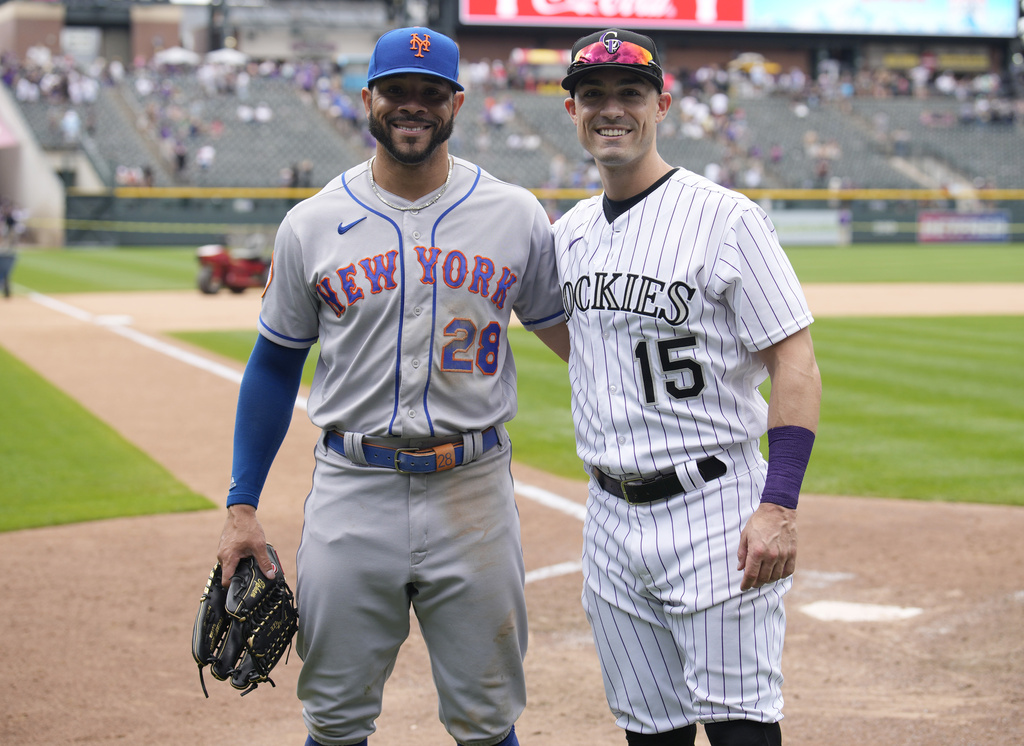 Tommy Pham and Randal Grichuk greet each other after a game in 2023.