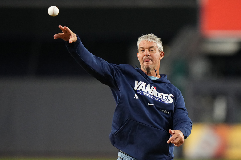 Former New York Yankees player Clay Bellinger throws out the ceremonial first pitch in Game 2
